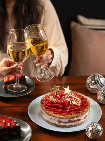 There's nothing like toasting to a new year with good company and a delicious cake. Our Strawberry Biscoff Cheesecake is the perfect centerpiece for any New Year's Eve party.