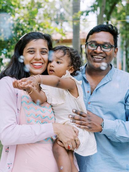 A family enjoying a moment with bubbles. A simple prop that brings so much magic and joy to a photoshoot.