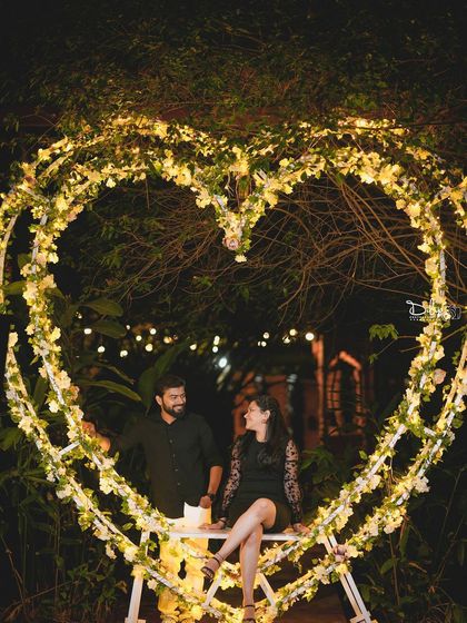 A quiet, romantic moment in the heart-shaped swing, perfect for a peaceful and intimate photo.