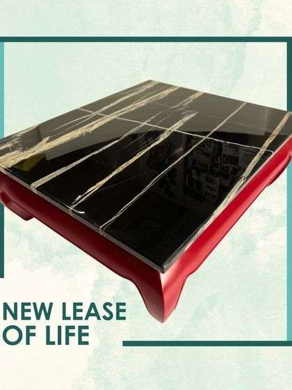 This vintage coffee table, restored in our workshop, is a bridge between design styles. The fiery red Ming-style base is paired with a sleek black stone top, creating a conversation piece that celebrates timeless design.