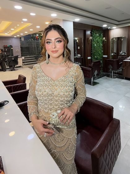 The full look, showing how the glamorous makeup complements her elegant gown. She is ready for the red carpet.