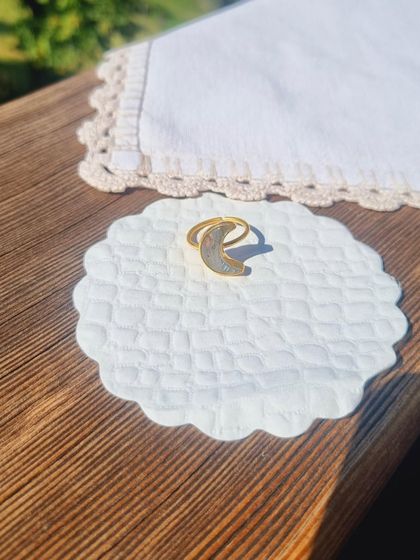 The 'chándra' Labradorite Luna Ring, pictured here in the sunlight. It's a powerful piece for anyone who needs help calming their thoughts and healing from stress.