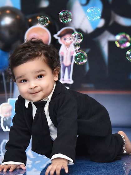 Crawling through the office with bubbles. The "Boss Baby" theme is full of playful details and opportunities for adorable, candid shots.