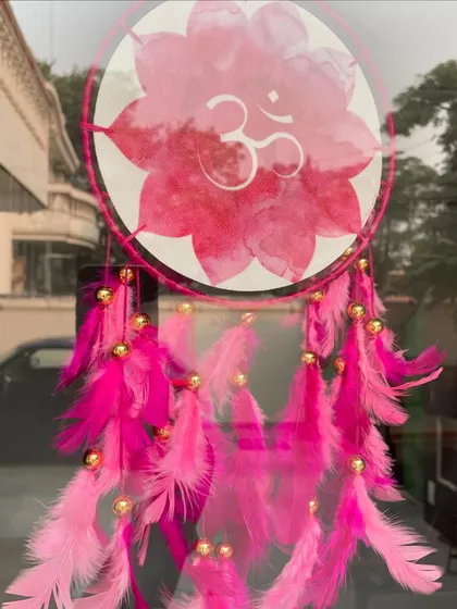 An Om dreamcatcher, sparking a thought: will I catch my dreams, or will my dreams catch me? A simple reflection on aspirations and destiny.