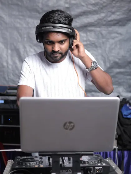 Focused and ready to drop the next track. This is a typical view of me at work, ensuring the music selection is perfect for the crowd.