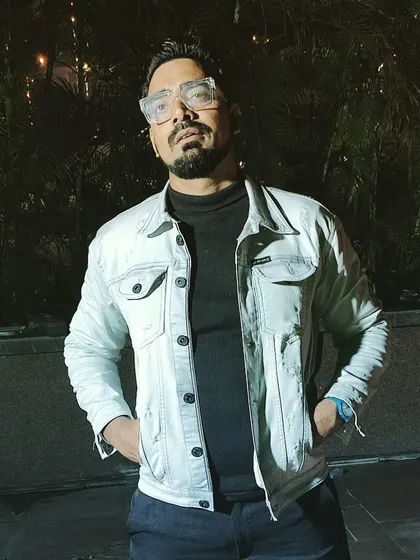Sporting a cool and casual look with a denim jacket after an amazing event. I can easily switch between formal and relaxed styles depending on what your party needs.