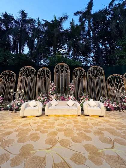 The stage at twilight, with the palm trees in the background, showcasing how the design integrates with the natural beauty of an outdoor venue.