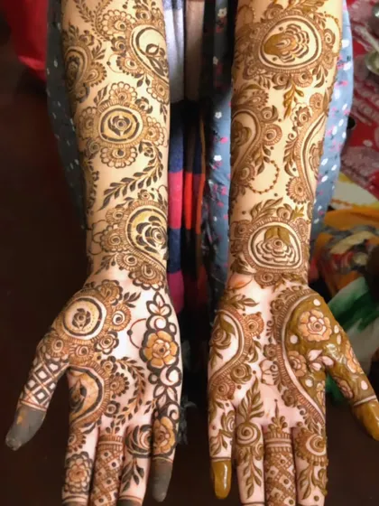 A full-arm designer style with a mix of paisley, floral, and geometric patterns. This is for when you want your mehendi to be a true work of art.