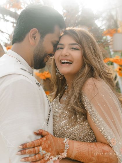 Pure, uninhibited laughter is the most beautiful thing to photograph. This candid embrace during Aditi and Dhiraj's celebration is a perfect example of the joyful, real moments I strive to capture.