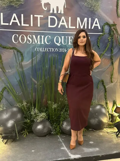 Posing at the Lalit Dalmia 'Cosmic Queen' collection event. The simple silhouette of my dress allows the event's creative backdrop to shine while still looking polished.