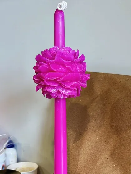 I'm always trying out new ideas! This was a trial for a new design, featuring a floral embellishment on a bright pink tapered candle.