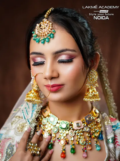 A close-up on the eye makeup of a contemporary bride. The soft pink and shimmer eyeshadow look is a popular and versatile technique that we teach all our students.