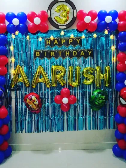 A classic Avengers theme setup for a 3rd birthday, using red and blue balloons to match the superhero colors. The backdrop includes character balloons for Captain America, Iron Man, Hulk, and Spider-Man.
