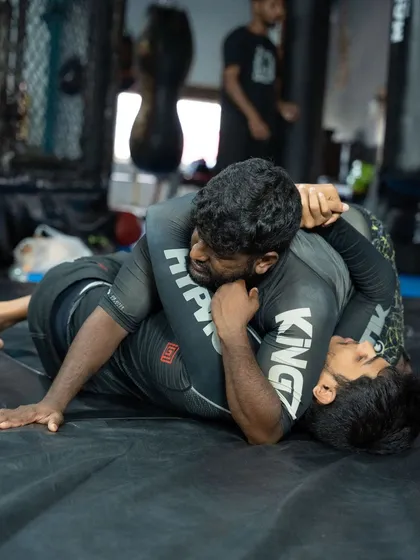 The grind on the mat. This is where fights are won. Our grappling program focuses on dominant positions and control, as our head coach demonstrates here. We drill wrestling and BJJ techniques relentlessly, so they become second nature in a real fight.