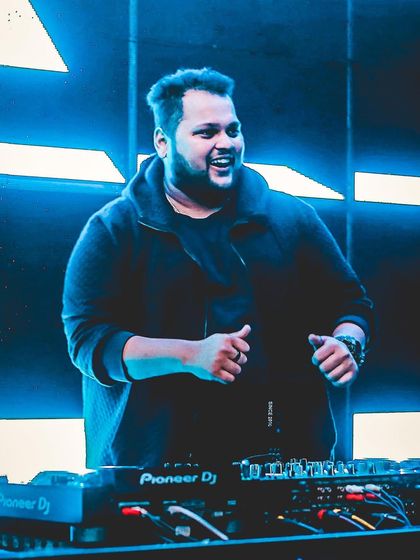 A happy, confident shot of me behind the decks. If you were looking for a sign, here it is.