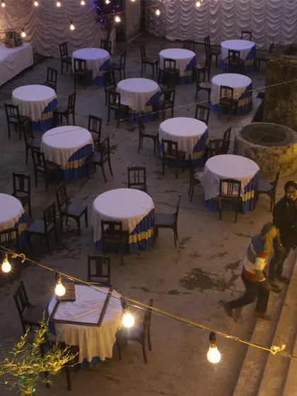 The courtyard of a heritage house in Chandernagore transformed into a venue for a pop-up dinner, an example of how temporary events can revive disused spaces.