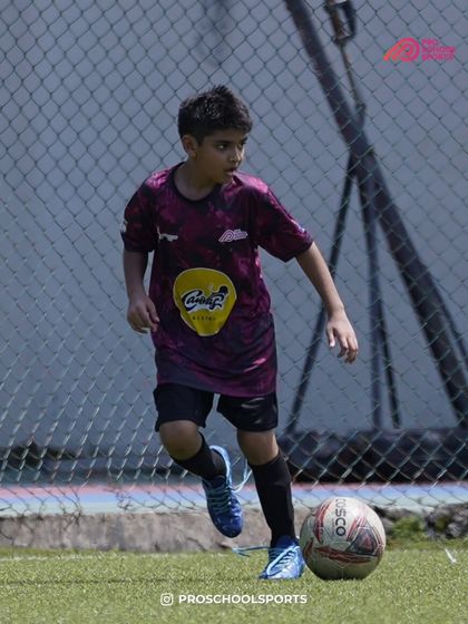 A player dribbles with focus, a great action shot from a past Thane Youth League game.
