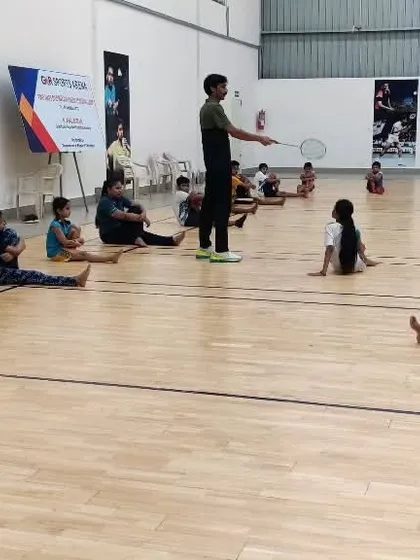 Young players doing floor exercises as part of their fitness training, a crucial element for all age groups.