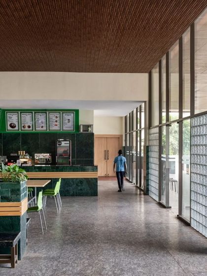 The public cafeteria inside the BJD headquarters is a bright, open space with green marble counters and a wall of glass blocks.