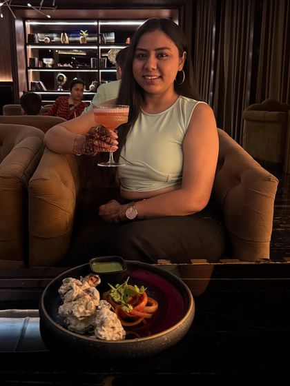 Another shot of me enjoying the food and drinks at Limitless Luxe, giving a personal touch to the dining experience.