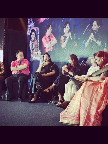 Speaking into the microphone during the panel discussion. I make sure to provide clear, direct information that victims of domestic violence can use.