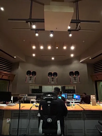 In the zone at a professional recording studio. Working with top-tier equipment and engineers is a non-negotiable part of my process to ensure broadcast-quality sound.
