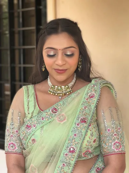 A close-up of the glittery eye makeup.