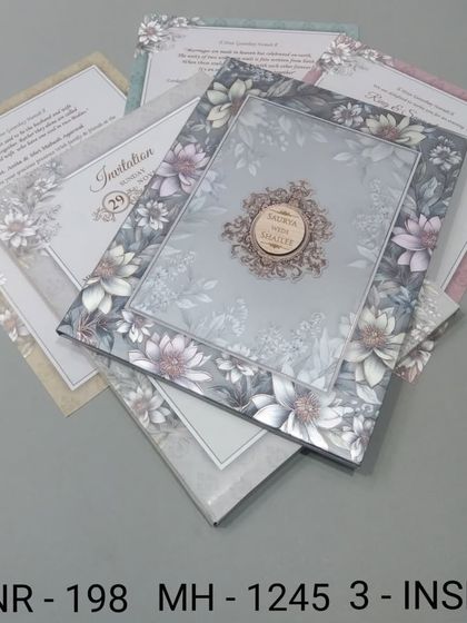 A lovely invitation with a dense floral pattern in muted, earthy tones. The design is sophisticated and comes with three inserts for a complete wedding suite.