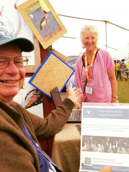 A guest signs up for our newsletter at the Global Birdfair. We love keeping our community updated on new tours, conservation news, and special offers.