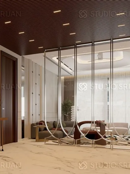 This image shows how I use decorative screens, like this one with elongated metal loops, to create visual separation in an open-concept space without blocking light or movement.