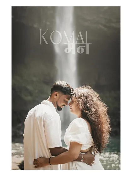 An intimate portrait in front of the majestic Devkund waterfall, blending the power of nature with the couple's connection.