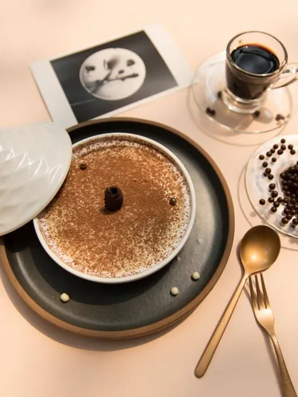 Our traditional Tiramisu is the perfect way to end your meal. The layers of coffee-soaked ladyfingers and creamy mascarpone cheese create a dessert that is both light and indulgent.