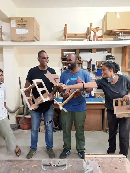 A fun, candid moment from a basic carpentry workshop. It's not just about learning, it's also about having a good time and making friends.