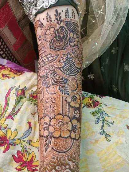 A close-up of the arm, showing the mix of floral and geometric patterns.