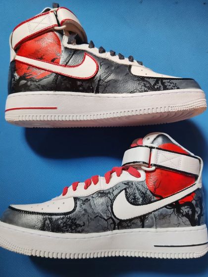 A throwback to this custom pair of Air Force 1 Mids with a Japanese theme. One shoe has a dragon, the other has a samurai, all in a grayscale and red color palette.