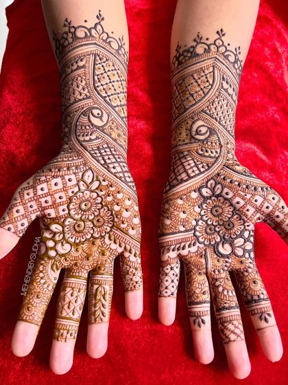 A beautiful design for the groom's sister-in-law, featuring a mix of peacock, floral, and geometric patterns.