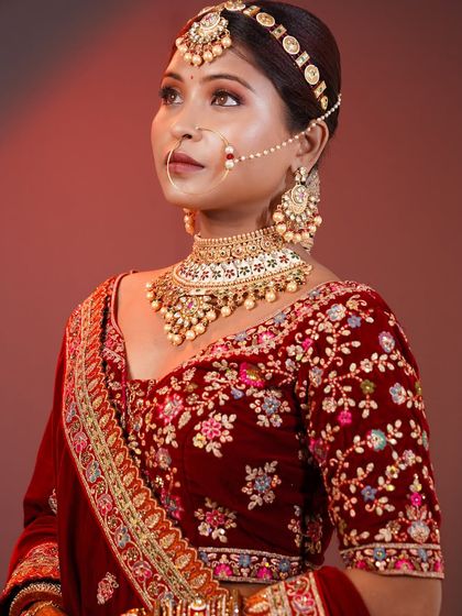 A closer look at the detailed makeup for a traditional bridal theme, showing the beautiful eye work and flawless base.