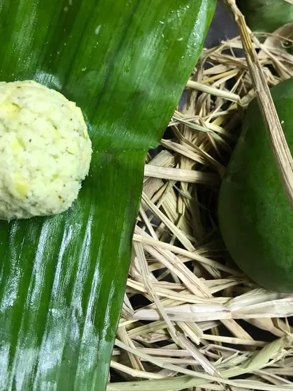 This is my Manga Chammanthi, a fresh, vibrant chutney made from raw green mangoes. Pictured here on a banana leaf next to the fruit itself, this dish celebrates seasonal ingredients at their peak, offering a zesty kick to any meal.