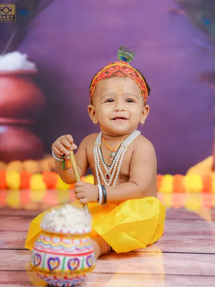 A happy little Krishna, ready to play his flute. The vibrant colors and joyful expression make this a perfect memory for Janmashtami.