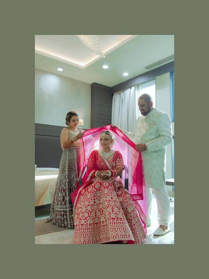 A touching moment as the bride gets ready with her family. This portrait captures the love and support surrounding her on her special day.