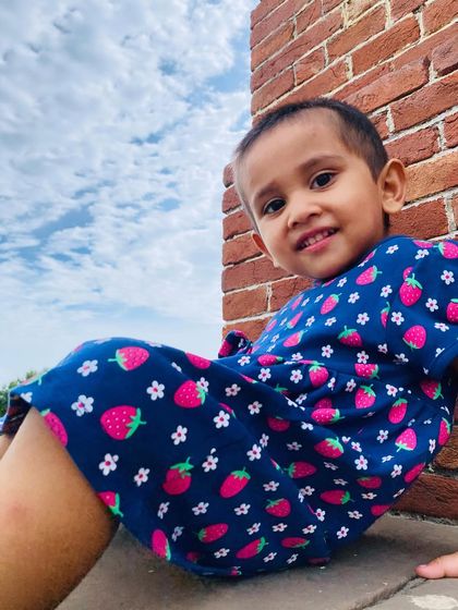 My daughter in a strawberry print dress from Firstcry. This was for a collaboration with Babyhug fashion, showcasing their cute and playful designs.