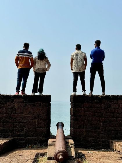 A classic 'Dil Chahta Hai' pose at a fort in Kannur, overlooking the Arabian Sea. We help you recreate iconic movie moments.