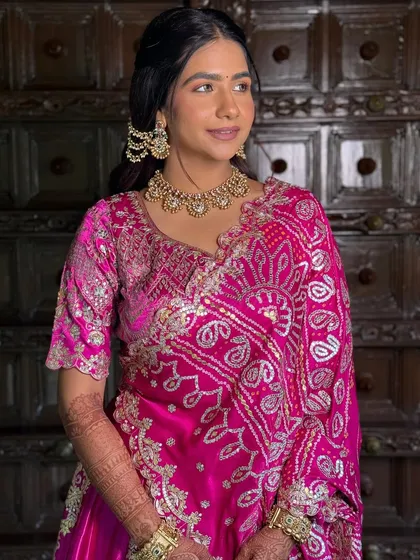 A close-up of the movie-star glam. The soft eyeshadow and radiant skin make her look like she stepped right out of a Bollywood film.