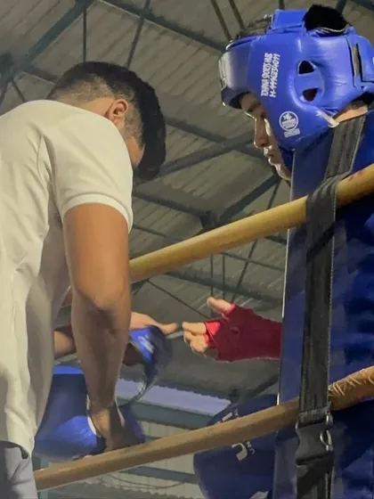 Another shot from the corner during the national championships. Clear, concise instruction is key to helping a fighter make adjustments mid-fight.