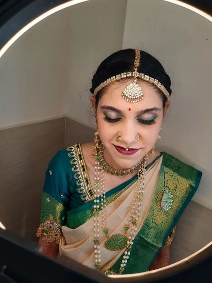 Another angle of Bride Shalini's Muhurtham makeup, showing the flawless blending of the eyeshadow and the smooth finish of the foundation.