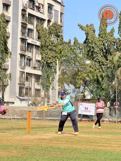 A woman plays a confident shot during a PPL match, showing great batting form.