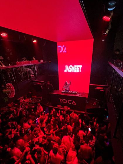 The view from the balcony at Toca, showing the entire club lit up in red.