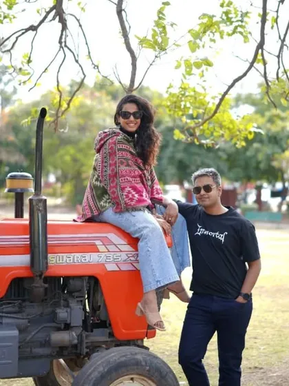 Who says you can't be stylish on a tractor? This is from my pre-wedding shoot, where we wanted fun, casual, and rustic vibes. I love helping couples plan their pre-wedding shoot outfits to reflect their personalities and story.