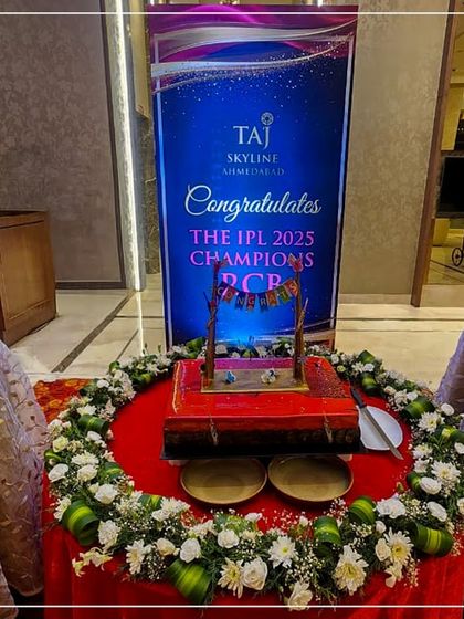 A custom-designed celebration cake and champagne setup for the IPL Champions. We specialize in creating bespoke celebratory moments for prestigious events.