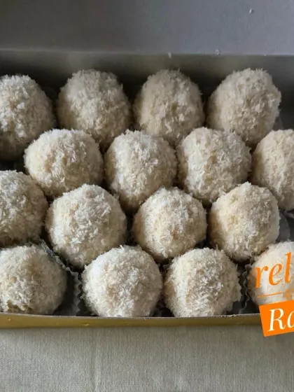 A box of my fresh Coconut Laddoos. The light, fluffy texture comes from using high-quality coconut and fresh milk.